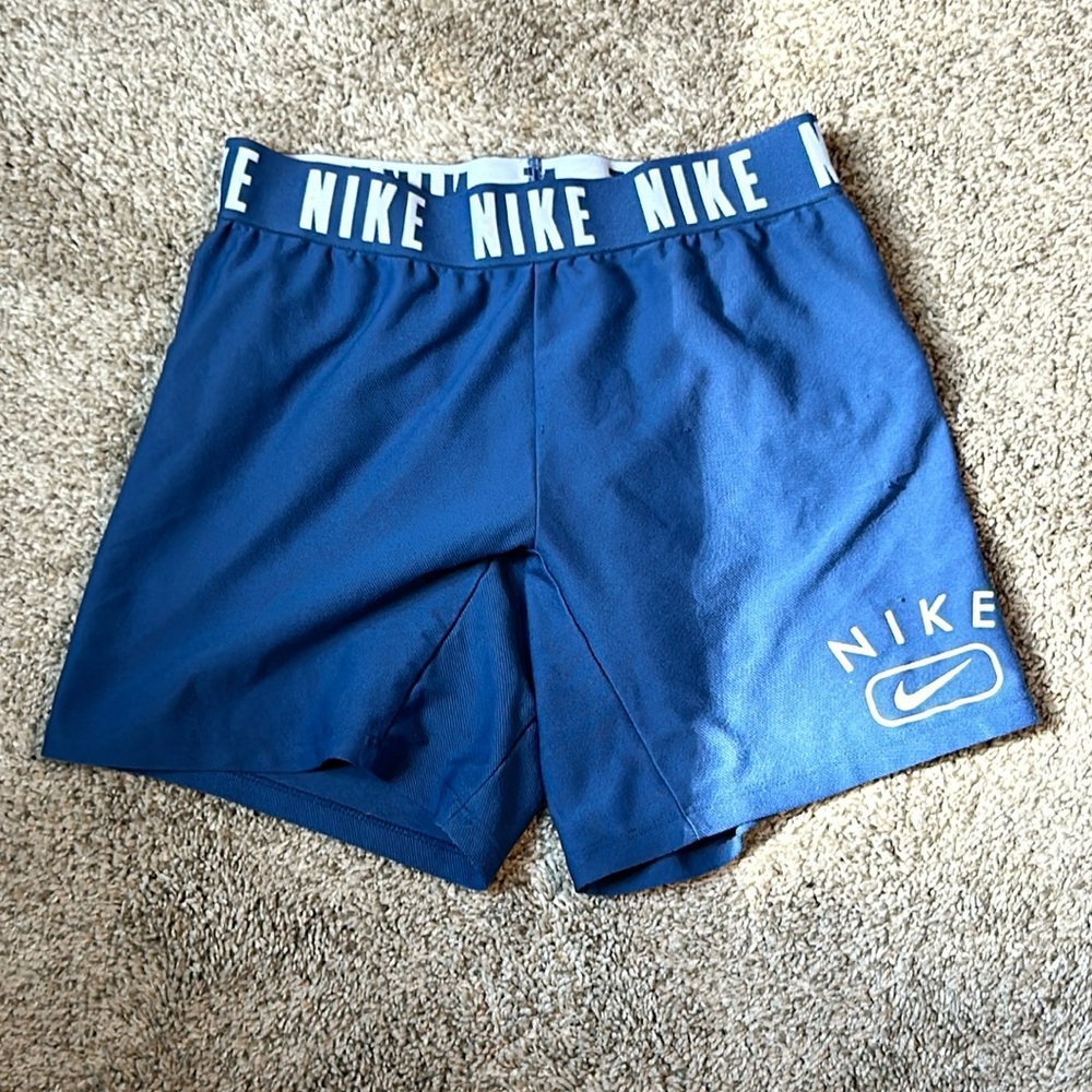 blue Nike spandex, size S in kids I believe